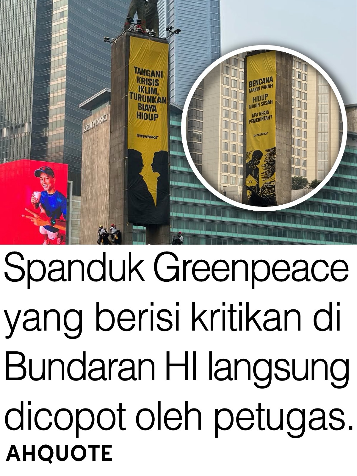 Aktivis Greenpeace membentangkan spanduk kritik di Bundaran HI